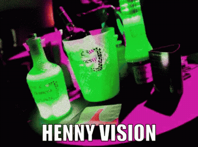 Bottle Of Hennessy Next To Green Cup GIF