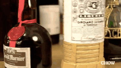 Bottle Of Liqueur Next To Ground Beef GIF