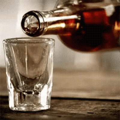 Bottle Of Liquor Poured Into Shot Glass GIF