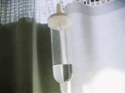 Bottle Of Water Hanging From Curtain GIF