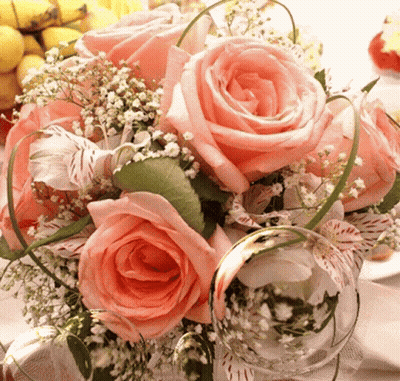 Bouquet Of Pink Roses With Baby's Breath And Greenery GIF