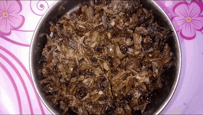 Bowl Of Food On Table With Purple Flowers GIF
