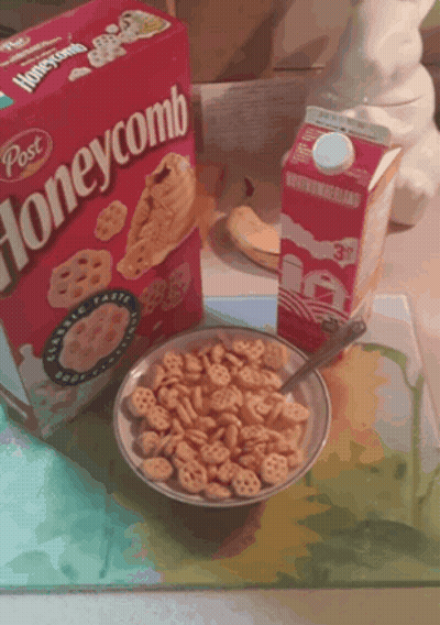 Bowl Of Honeycomb Cereal Next To Box GIF