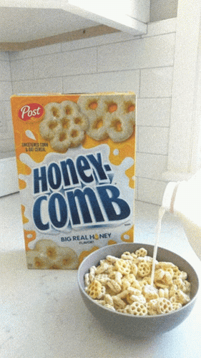 Bowl Of Honeycomb Cereal Next To Box GIF