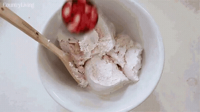 Bowl Of Ice Cream Stirred With Wooden Spoon Country Living GIF