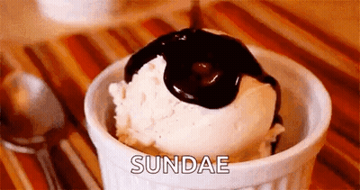 Bowl Of Ice Cream With Chocolate Sauce Pouring GIF