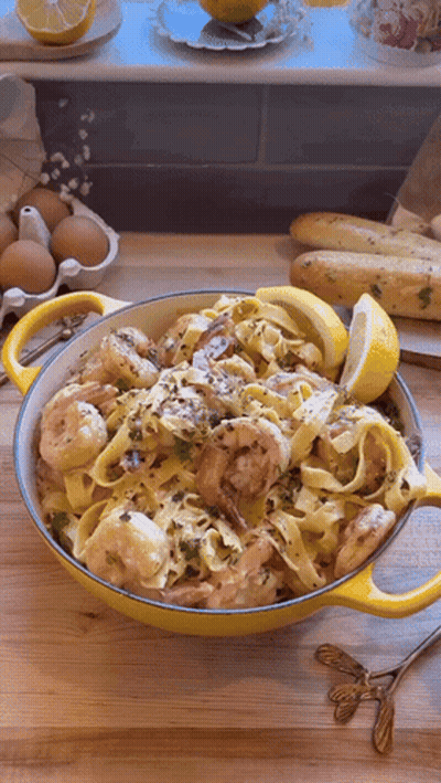 Bowl Of Pasta With Shrimp And Lemon Slices GIF