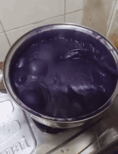 Bowl Of Purple Liquid On Stove Next To Smart Container GIF