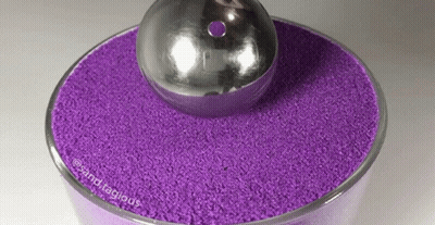 Bowl Of Purple Sand With Silver Ball GIF