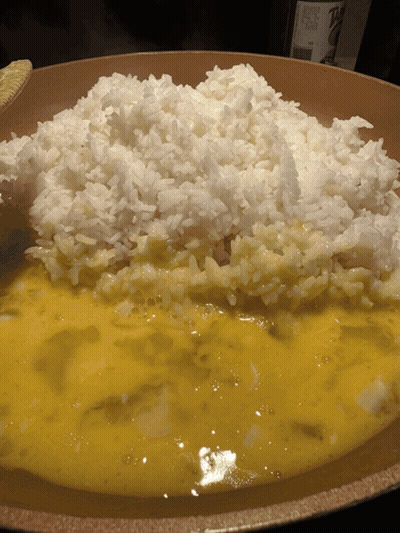 Bowl Of Rice With Yellow Sauce And Wine GIF
