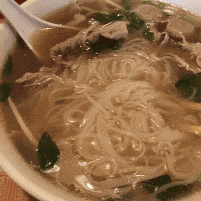 Bowl Of Soup With Noodles And Meat And Spoon GIF