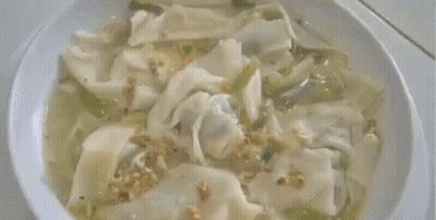 Bowl Of Wonton Soup With Noodles And Vegetables GIF