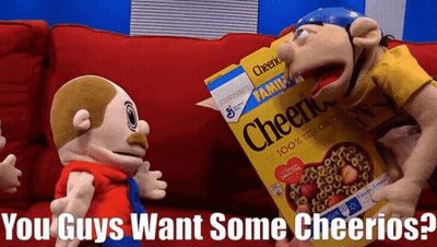 Box of Cheerios on Couch With Stuffed Animals