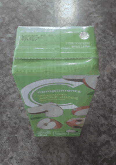 Box Of Compliments Apple Juice On Counter GIF