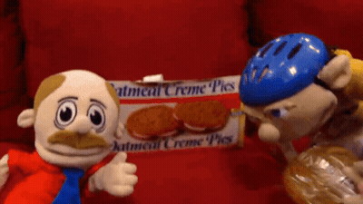 Box Of Oatmeal Creme Pies On Red Surface GIF