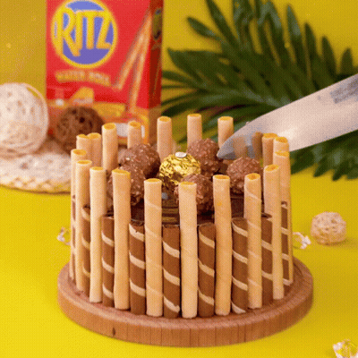 Box Of Ritz Wafer Sticks On Yellow Table GIF