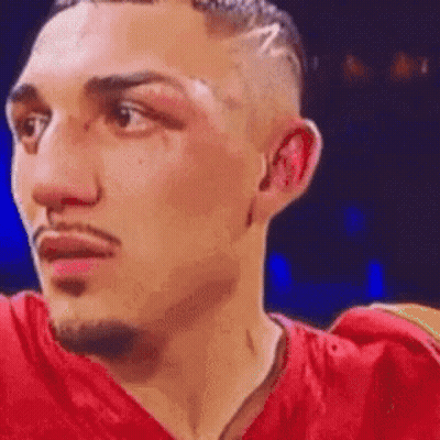 Boxer In Red Shirt Looking At Camera GIF