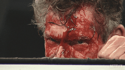 Boxer With Blood On Face In Ring With Netflix Logo GIF