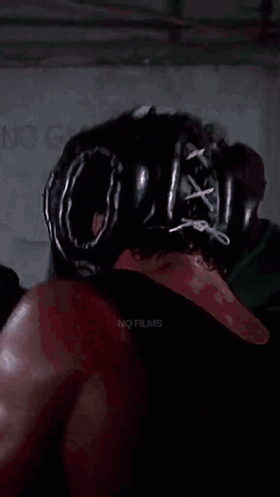 Boxer With Helmet And Gloves Fighting Another GIF