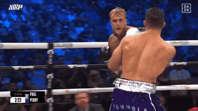 Boxers Fighting In Ring Purple Shorts GIF