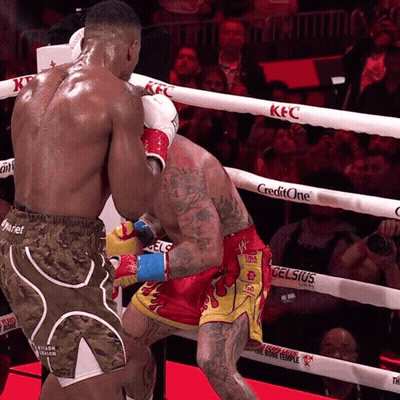 Boxers Fighting In Ring Sponsored By KFC And CreditOne GIF