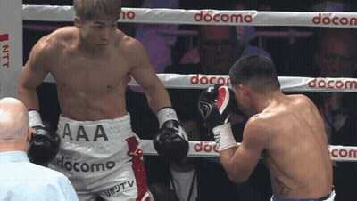 Boxers Fighting In Ring With Docomo Ropes GIF