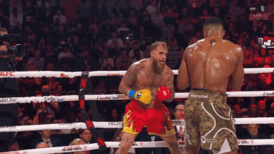 Boxers In Ring One Wearing Home Team Shorts GIF