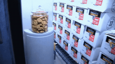 Boxes Of French Bread Are Stacked On Top Of Each Other In A Store GIF