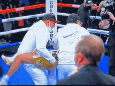 Boxing Ring With Gold Body Sign GIF