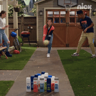 Boy And Girl Bowling In Front Of Nick Basketball Hoop GIF