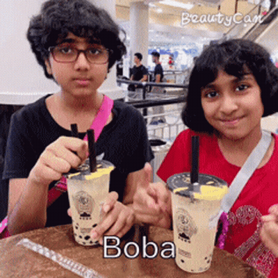Boy And Girl Drinking Boba GIF