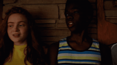 Boy And Girl Holding Microphones Saying Build GIF