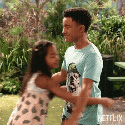 Boy And Girl Hugging Boy In Top Dog Shirt GIF