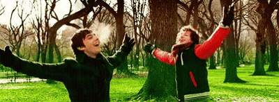 Boy And Girl Jumping In Park GIF
