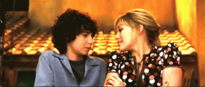 Boy And Girl Kissing In Restaurant GIF
