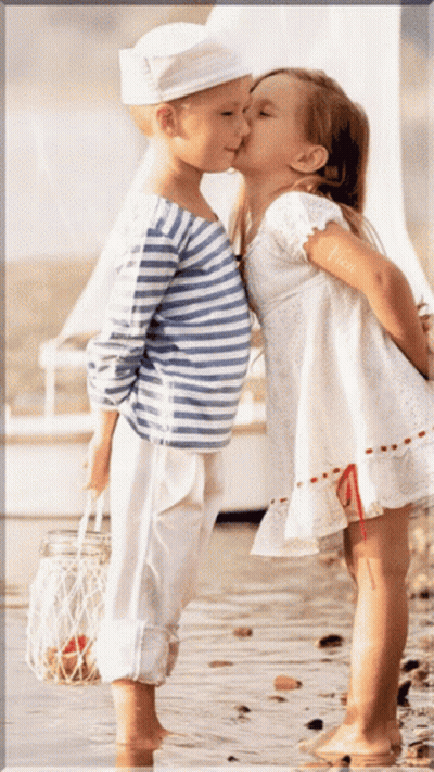 Boy And Girl Kissing On Beach GIF