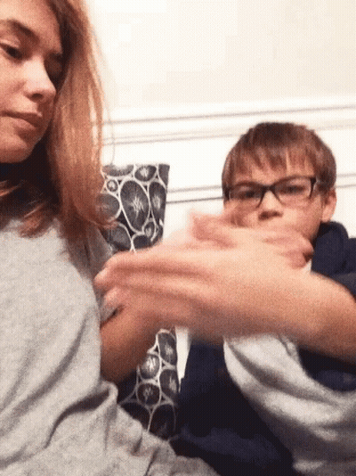 Boy And Girl Playing On Couch GIF