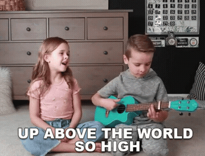 Boy And Girl Playing Ukuleles Up Above The World So High GIF