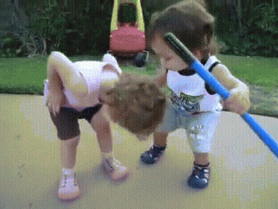 Boy And Girl Playing With Hula Hoop On Sidewalk GIF