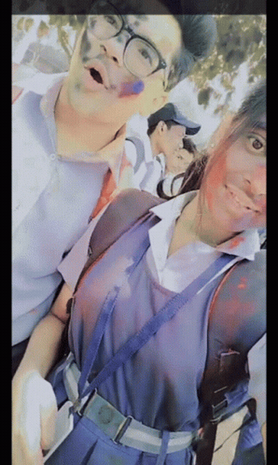 Boy And Girl Posing With Holi Colors GIF