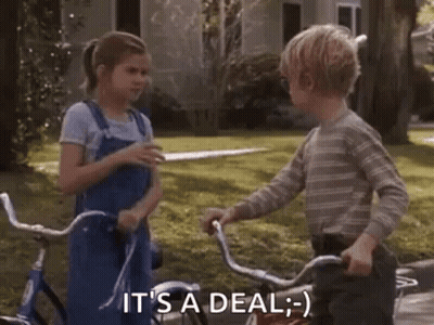 Boy And Girl Shaking Hands On Bicycles GIF