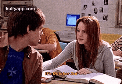 Boy And Girl Sitting At Desk Girl Talking To Boy GIF