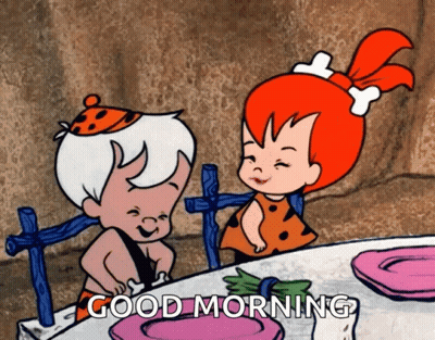 Boy And Girl Sitting At Table Saying Good Morning GIF