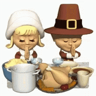 Boy and Girl Sitting at Table With Turkey