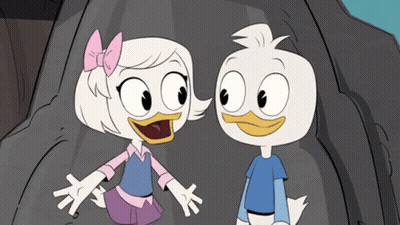 Boy And Girl Standing Next To Each Other GIF