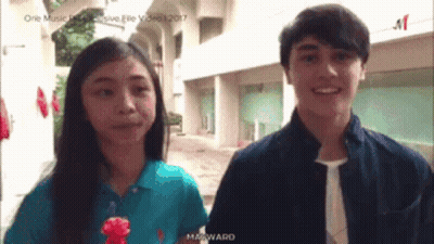 Boy And Girl Standing Together Girl In Blue Ralph Lauren Shirt GIF