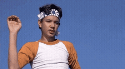 Boy And Man In Karate Uniforms Talking GIF