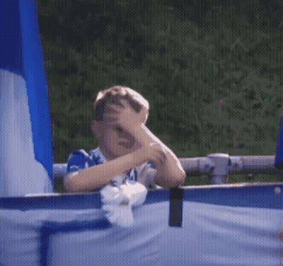 Boy Covering Face In Blue And White Shirt Number 44 GIF