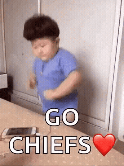 Boy Dancing In Front Of Go Chiefs Table GIF
