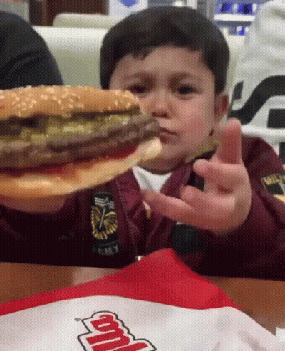 Boy Holding Hamburger With Army Bag GIF